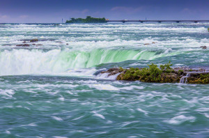 Use a slower shutter speed to show the movement of a waterfall