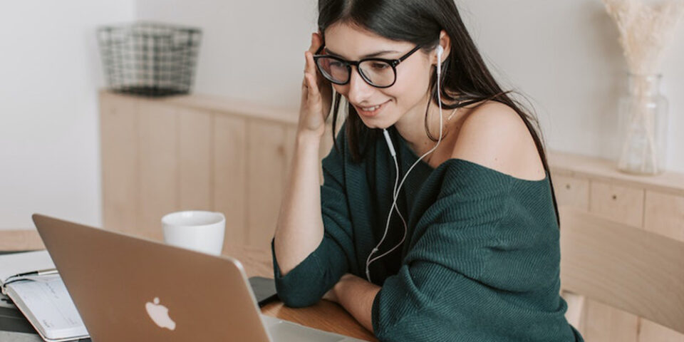girl watching a video on a laptop