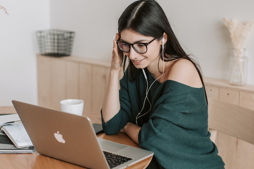 girl watching a video on a laptop